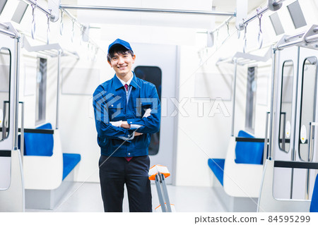 Male technical staff doing train maintenance Male technical staff doing train maintenance 84595299