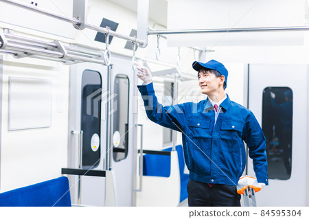 Male technical staff doing train maintenance Male technical staff doing train maintenance 84595304