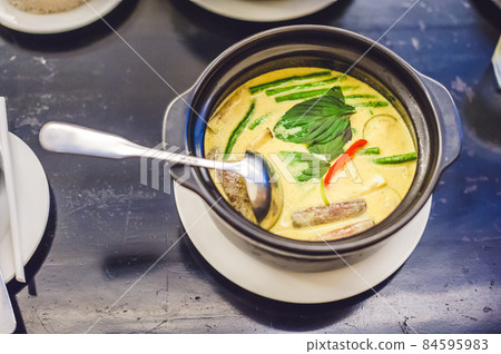 Thai food chicken green curry on dark wooden background. top view. Thai cuisine concept 84595983