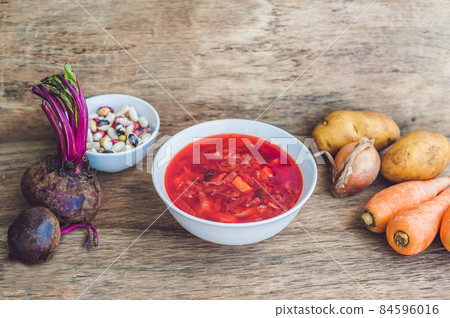Traditional Ukrainian Russian vegetable borscht soup on the old wooden background 84596016