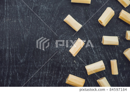 Pieces of cane sugar on the old wooden background. Sugar concept Pieces of cane sugar on the old wooden background. Sugar concept 84597184