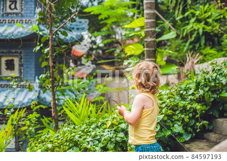 Boy tourist in Buddhist temple in Vietnam Nha Trang 84597193