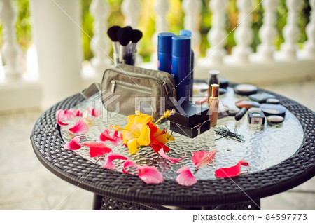 Spa, wellness setting with fresh flowers on a palm leaf background 84597773