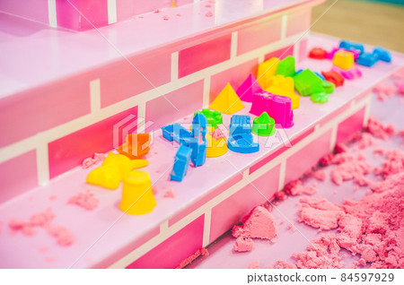 Figures from the pink kinetic sand The development of fine motor concept. Creativity Game concept 84597929