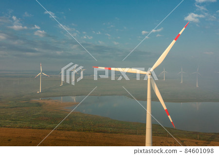 Windmills or wind turbine in morning light 84601098