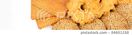 Assortment of cookies isolated on a white . Wide photo.There is free space for text. 84601288