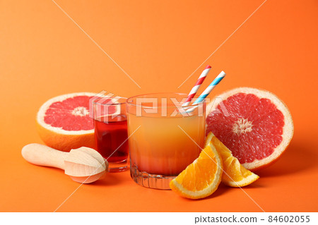 Concept of cooking Tequila sunrise cocktail on orange background 84602055