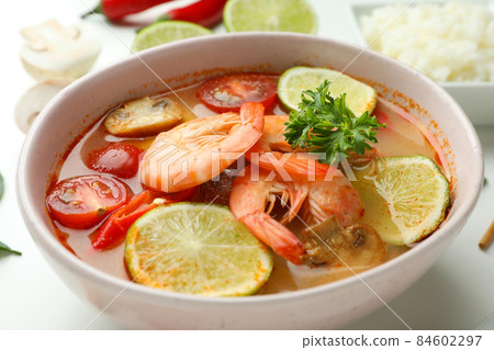Plate of tasty Tom yum soup, close up Plate of tasty Tom yum soup, close up 84602297