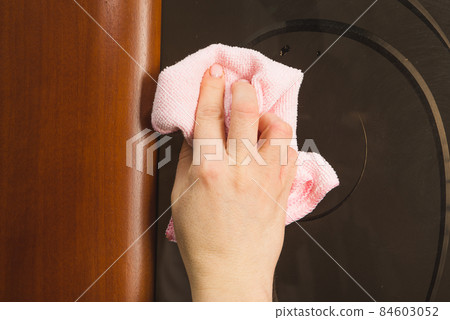 Hand with microfiber cloth cleaning car. Hand with microfiber cloth cleaning car. 84603052