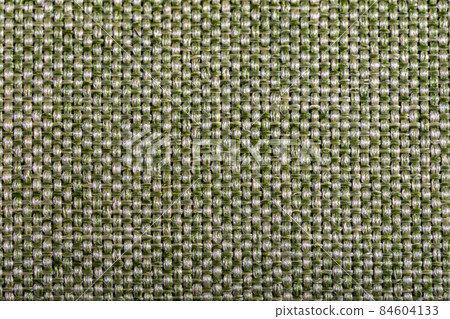 Green fabric texture. Furniture upholstery textiles. Embossed pattern. Woven fibers. The material is soft touch. Minimalism concept. High detail macro photography for backgrounds or wallpapers. 84604133