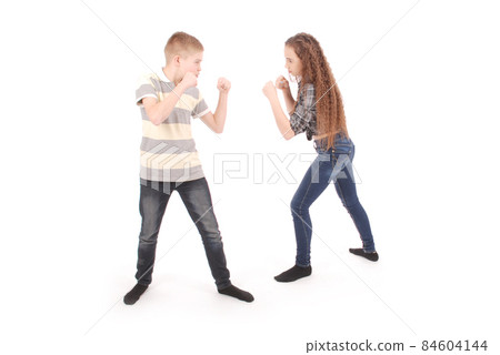 Boy and girl boxing. Two angry children. 84604144