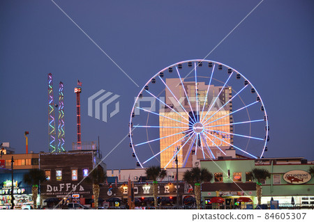 This is the skyline of Myrtle Beach with the Myrtle Beach Skywheel. It is on the boardwalk along the Atlantic Ocean in South Carolina 84605307