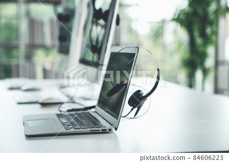 Headset and customer support equipment at call center ready for actively service 84606223