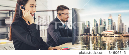 Business people wearing headset working in office broaden view Business people wearing headset working in office broaden view 84606543