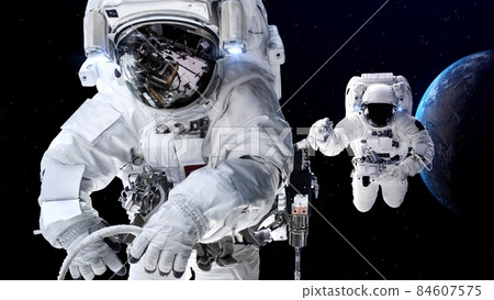 Astronaut spaceman do spacewalk while working for spaceflight mission 84607575
