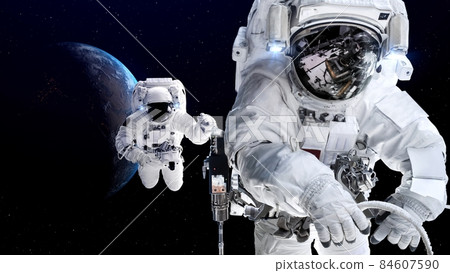 Astronaut spaceman do spacewalk while working for spaceflight mission 84607590