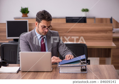 Young businessman employee working in the office Young businessman employee working in the office 84609141