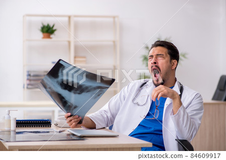 Young male doctor radiologist working in the clinic Young male doctor radiologist working in the clinic 84609917