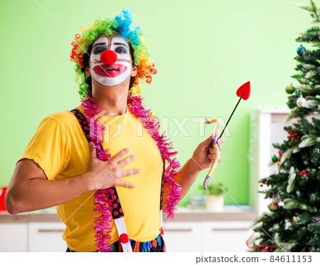 Funny clown in Christmas celebration concept Funny clown in Christmas celebration concept 84611153