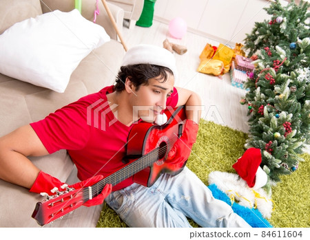 Young man drunk at home after christmas party 84611604