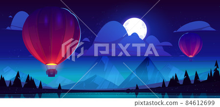 Hot air balloons fly over mountain lake at night Hot air balloons fly over mountain lake at night 84612699