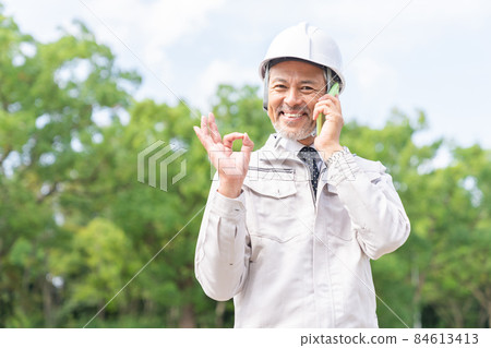 Senior male business in work clothes to call Senior male business in work clothes to call 84613413