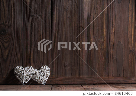 Two hearts on wooden background Two hearts on wooden background 84613463