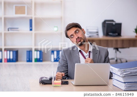 Young male employee working in the office 84615949