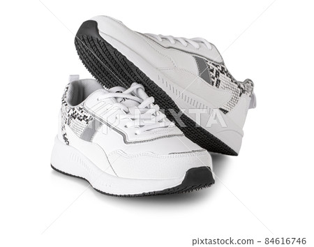 Pair of white woman style sport shoes isolated on whiite background with clipping path Pair of white woman style sport shoes isolated on whiite background with clipping path 84616746