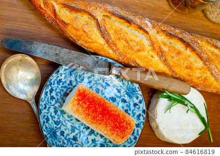 French cheese and fresh  baguette on a wood cutter 84616819