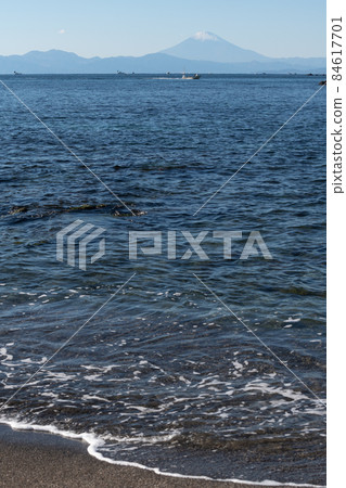 Mt. Fuji overlooking Sagami Bay from the Wadanahama coast 84617701
