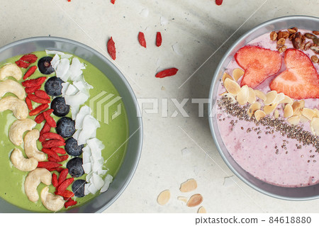 Italian coffee maker with wooden handle and white coffee craft cup on solid wood stamp decorated with tea towels in creamy tones on sunlight creating beautiful shadows on the wall 84618880