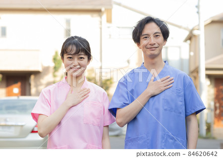 Medical staff standing in a residential area 84620642