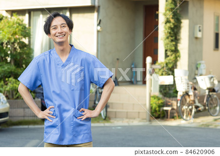 Medical staff standing in a residential area Medical staff standing in a residential area 84620906