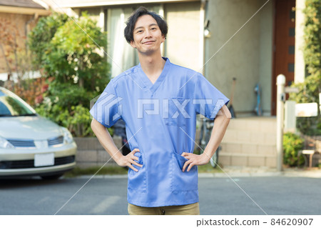 Medical staff standing in a residential area 84620907
