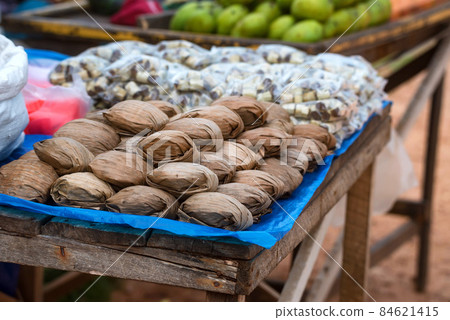 Jaggery or palm sugar for sale on market Jaggery or palm sugar for sale on market 84621415