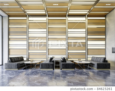 Black quilted sofas with a table in the waiting area against a backlit wooden wall. 84623261
