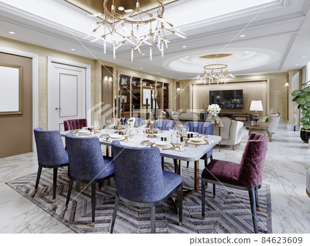 Dining area with a sumptuous dining table in the large living room with yellow walls and marble floor. Dining area with a sumptuous dining table in the large living room with yellow walls and marble floor. 84623609