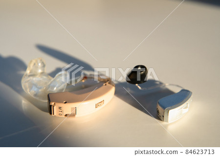 Old Hearing Aids and Current Hearing Aids 84623713