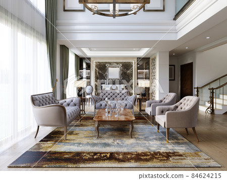 Modern living room in classic style with seating area made of soft quilted furniture and a large chandelier and a white fireplace and shelves in the wall. Modern living room in classic style with seating area made of soft quilted furniture and a large chandelier and a white fireplace and shelves in the wall. 84624215
