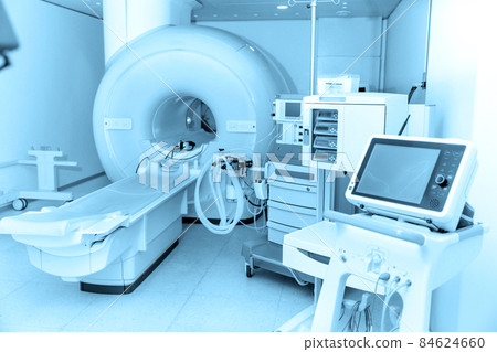 Medical CT or MRI Scan in the modern hospital laboratory. Interior of radiography department. Technologically advanced equipment in white room. Magnetic resonance diagnostics machine. Medical CT or MRI Scan in the modern hospital laboratory. Interior of radiography department. Technologically advanced equipment in white room. Magnetic resonance diagnostics machine. 84624660