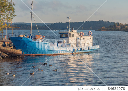 Ship for the nature watching. Lake Ladoga at autumn evening. Republic of Karelia. 84624978