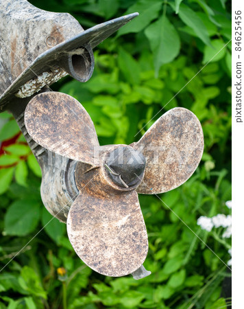 Closeup fishing boat screw propeller. Worn out and rusty Closeup fishing boat screw propeller. Worn out and rusty 84625456