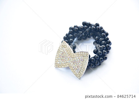 hair band made from black bead decoration diamond bow tie on white background 84625714