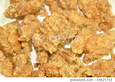 crispy fried Korean chicken breast with bread crumb and egg yolk on plate dipping spicy sauce crispy fried Korean chicken breast with bread crumb and egg yolk on plate dipping spicy sauce 84625718