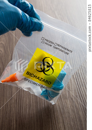 Covid-19 Rapid Antigen Test kit and biohazard specimen bag. Concept of waste separation 84625815