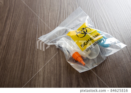 Covid-19 Rapid Antigen Test kit and biohazard specimen bag. Concept of waste separation 84625816