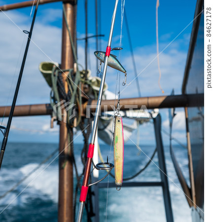 Image of boat fishing lure and fishing rod 84627178