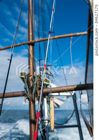Image of boat fishing lure and fishing rod 84627179