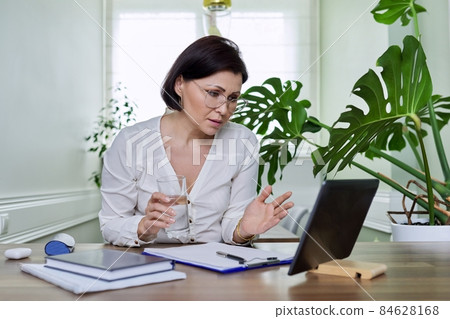 Business woman, mentor, social worker working remotely, using a digital tablet 84628168